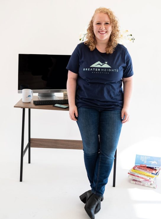 Hailey Fackrell standing in front of desk